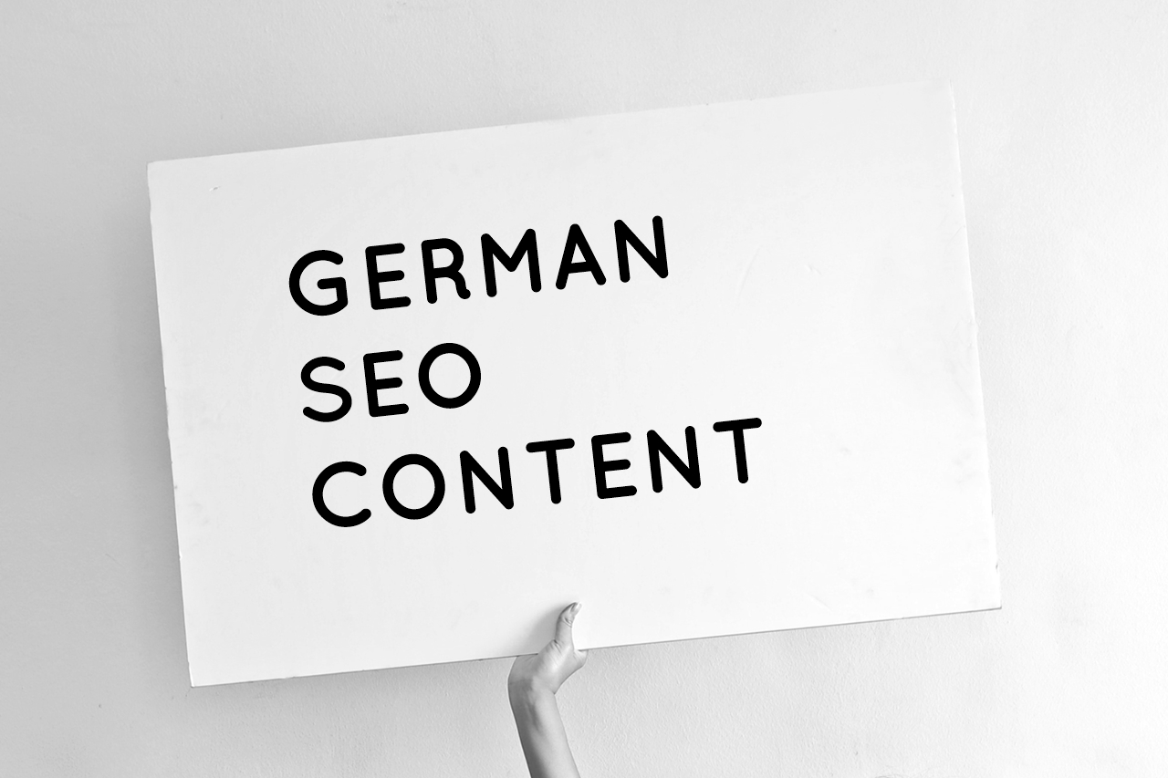 Hand holding a sign saying "German SEO Content"