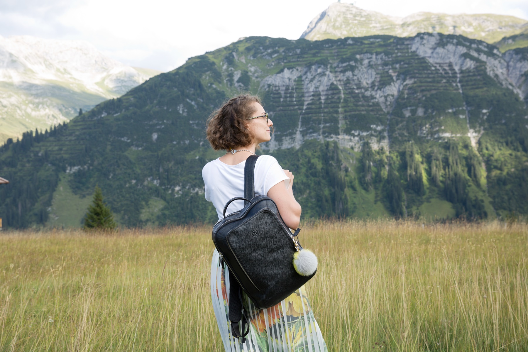 German travel writer Monika Weber standing in front of a moutainscape